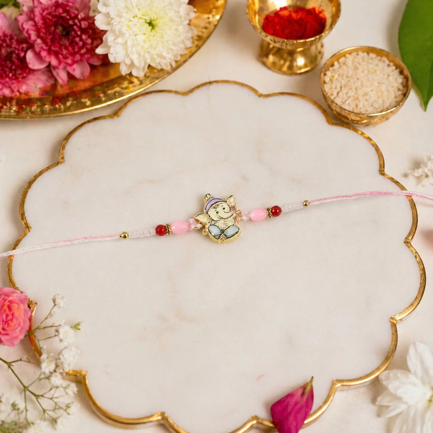 Elegant Floral Ganesh Pearl Rakhi