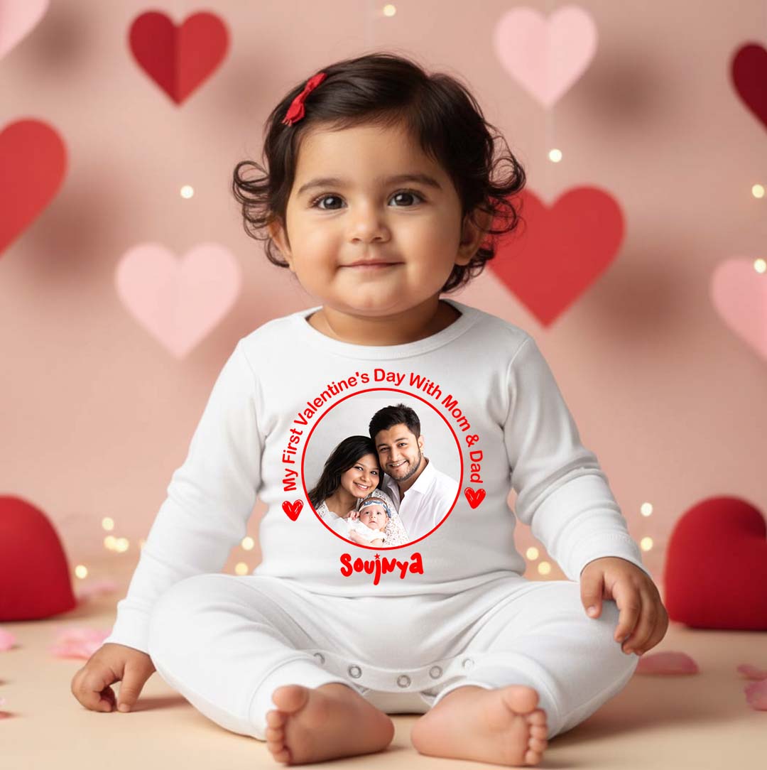 Child wearing a Valentine's Day-themed onesie with a photo of a couple and baby, surrounded by heart decorations.