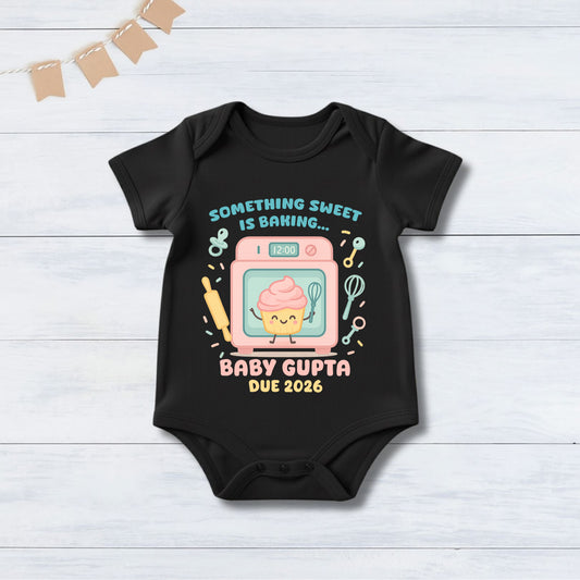 Something Sweet Is Baking... Baby Gupta Due 2026 With Customized Surname infant onesie_ Black