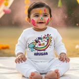 Baby wearing a 'My First Holi' outfit  