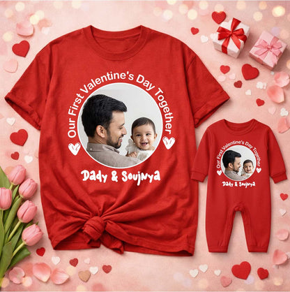 Red t-shirt and baby onesie with a photo of a father and child, text 'Our First Valentine's Day Together' on a pink background with hearts and flowers.